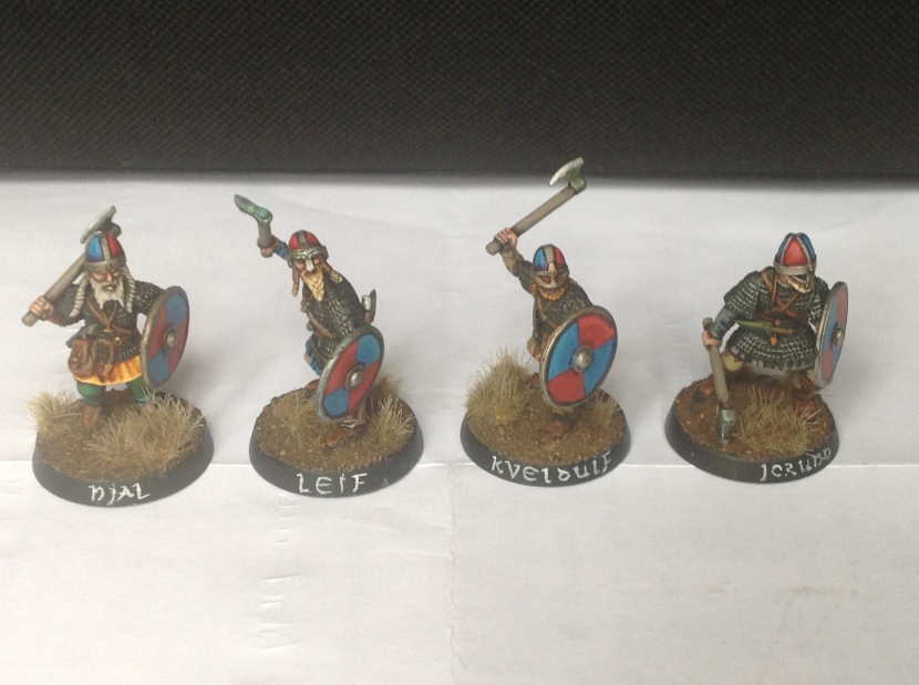 Four hirdmen with axes.